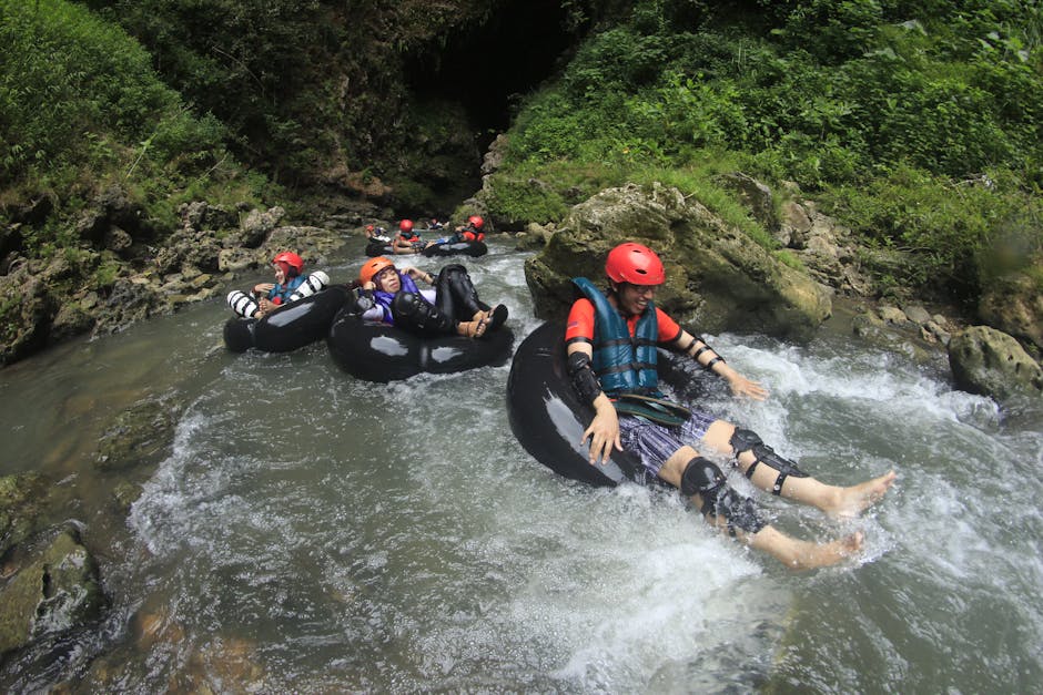 Thrill-seekers enjoy a tubing adventure through a scenic river in Semanu, Indonesia